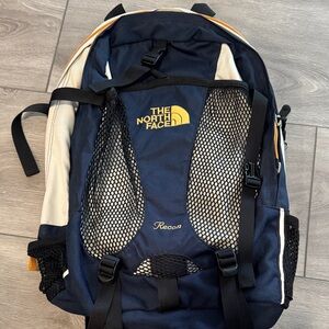 The North Face Navy and Cream Recon Backpack with Yellow Logo